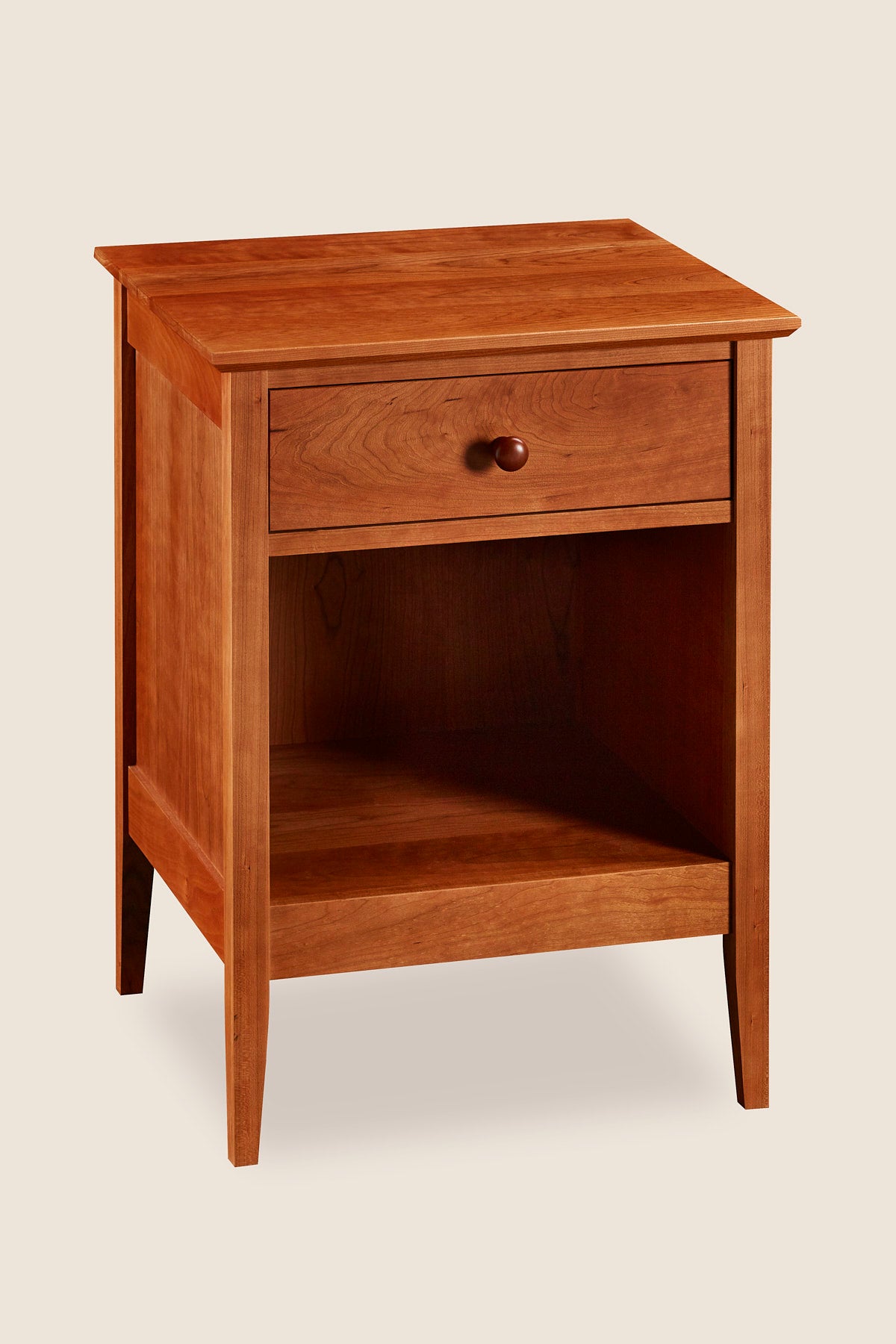 Simple Shaker nightstand with one drawer and tapered legs, in cherry wood, from Maine's Chilton Furniture Co.