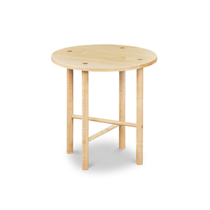 Round Scandinavian style end table with round legs in clear maple